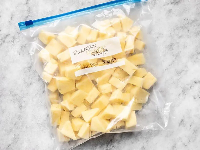 flash freezing pineapple on baking sheet