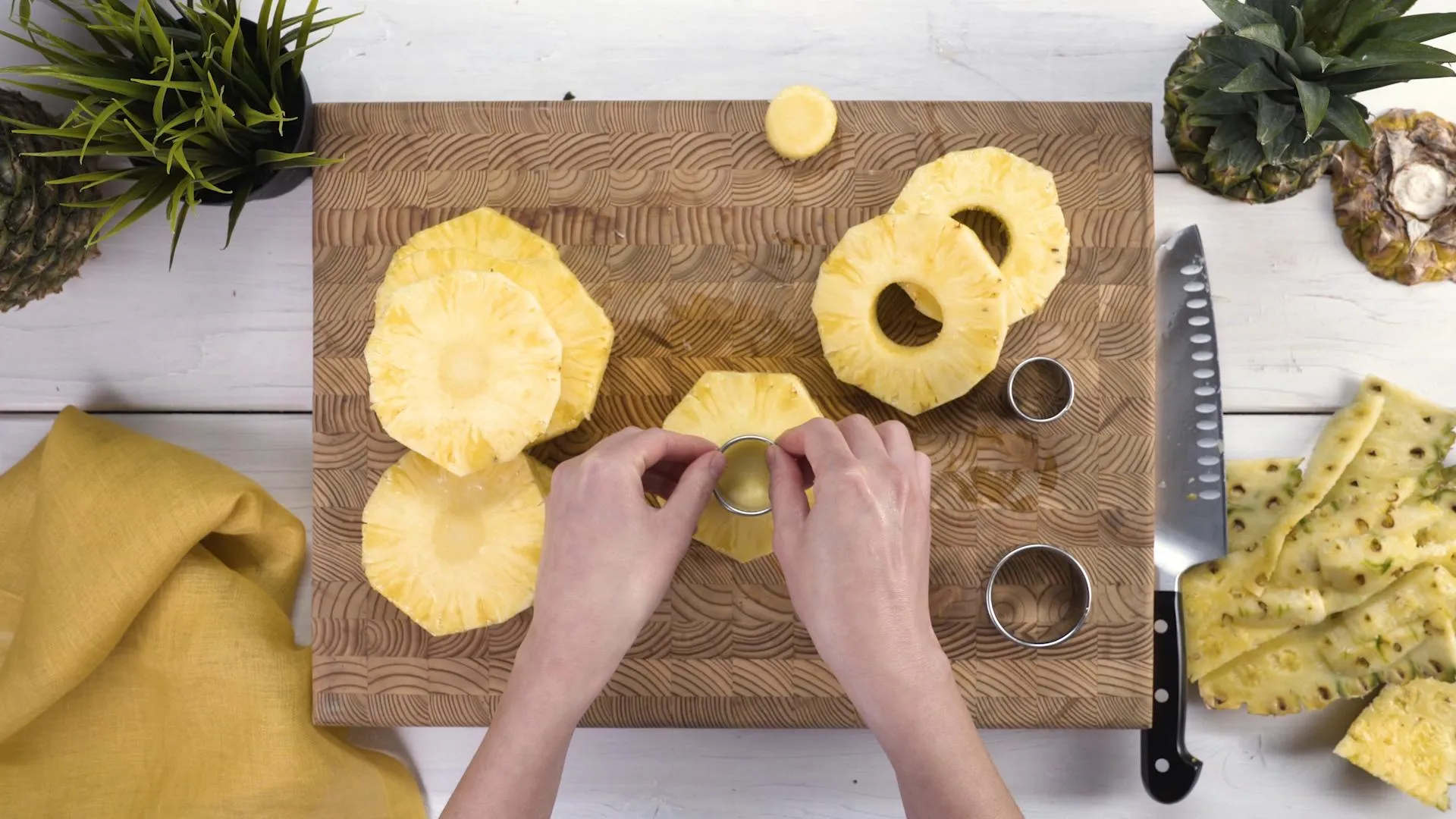 Using a pineapple corer to create even pineapple rings