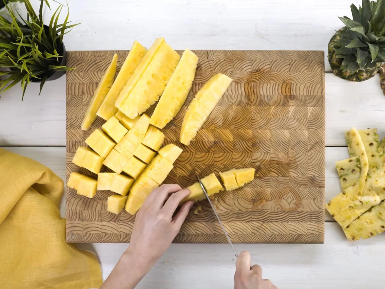 Cut the pineapple into chunks, cubes, or dice