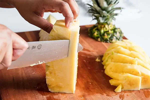 Quartered pineapple with the core removed
